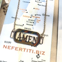 a necklace with a map on it